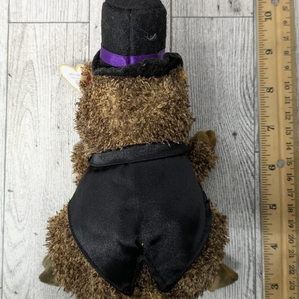 Ty Brown Stuffed Bear with Black Hat and Purple Bow